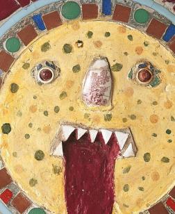 Œuvre d'art brut représentant un visage qui tire la langue.